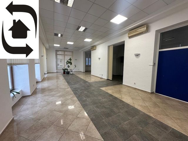 Spacious commercial premises with tiles and office partitions.