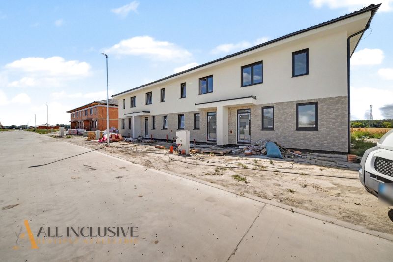 A family house in Dolný Bar during construction work, showing multiple residential units.