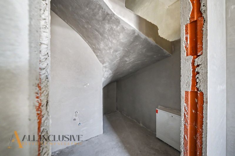 The interior of a family house with unfinished walls and electrical wiring.