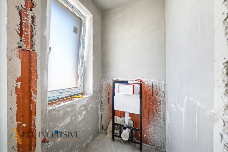 Construction work in the bathroom of a family house with preparation for sanitary installation.