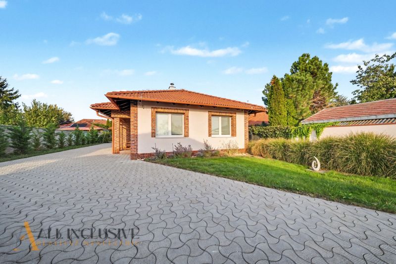 A family house on Kostolné Kračany Street in Dunajská Streda with a landscaped garden and driveway.