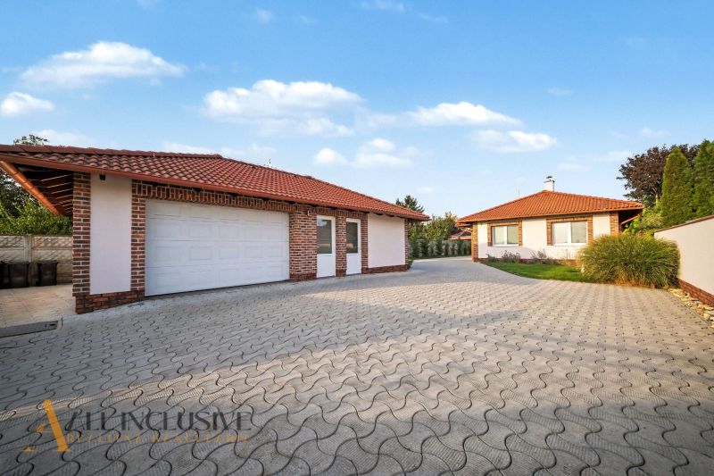 A family house in Kostolné Kračany near Dunajská Streda with a garage and a paved driveway.