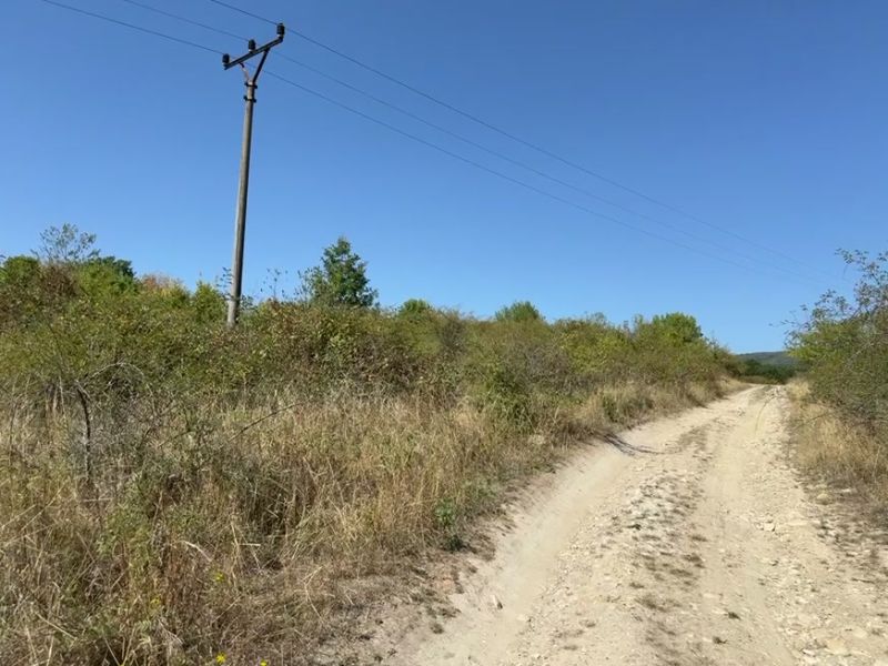 Agricultural and forest land near Kučišdorfská Street in Pezinok with electrical wiring.