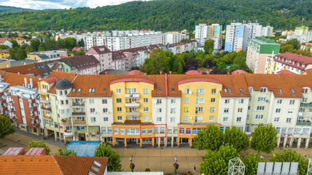 Buildings on Moyzesova Street in Púchov with commercial spaces on the ground floor.