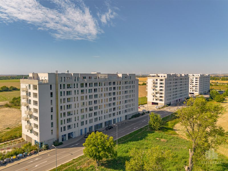 Apartment buildings on Labutia Street in Bratislava – Petržalka, surrounded by fields and greenery.