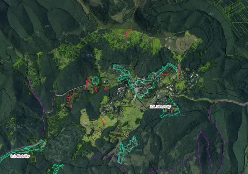 Aerial map of agricultural and forest lands near Donovaly surrounded by dense forests.