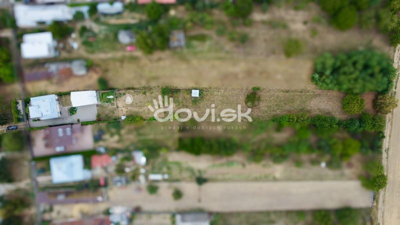 Aerial view of gardens and family houses on Topolianska Street in Michalovce.