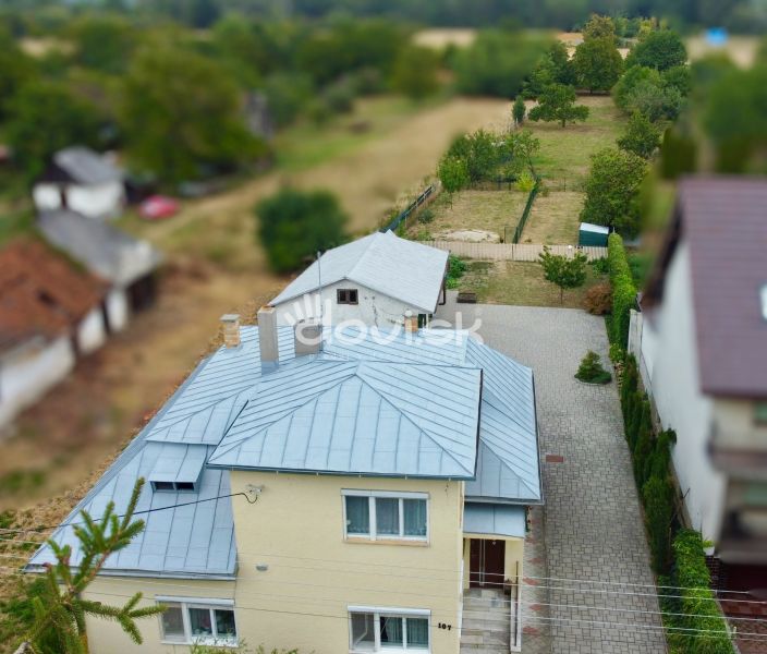 A family house on Topolianska Street in Michalovce with a landscaped yard and garden.