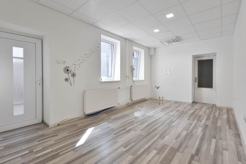 Commercial spaces with wood-patterned flooring and wall decorations.