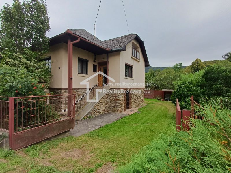 A family house in Drnava with a garden, stone facade, and entrance staircase.