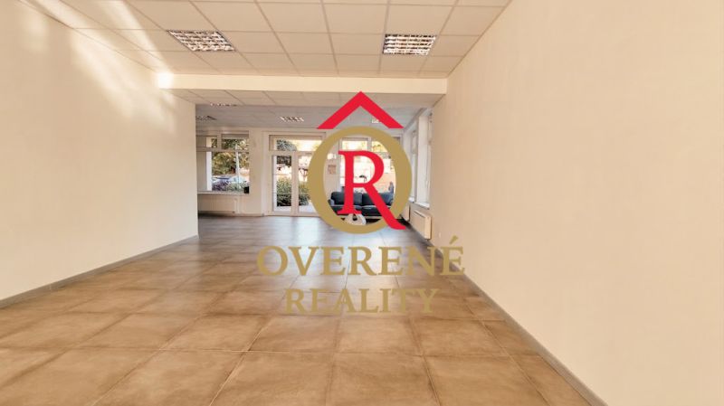 Spacious offices with tiled floors and large windows bring in natural light.
