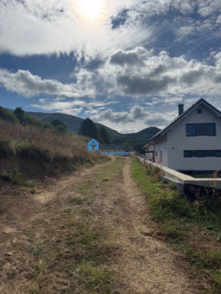 A country road leads to a house on the outskirts of Považská Bystrica, ideal for residential plots.