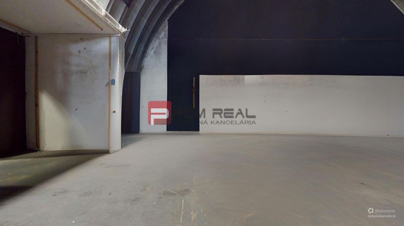 Empty office interior with white walls and concrete floor.