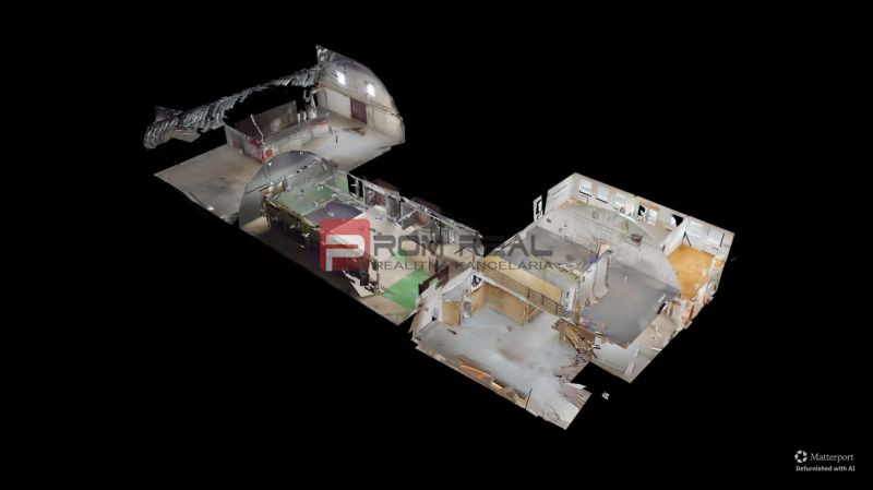 3D visualization of the interior space of an office with various rooms and equipment.
