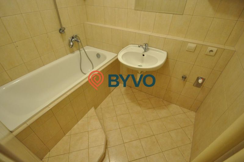 Bathroom with a shower bath and a sink in a 3-room apartment.