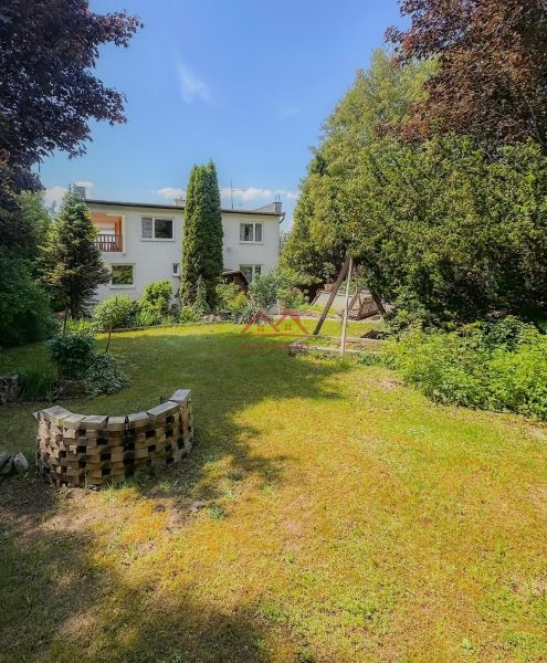 A family house in Sady nad Torysou surrounded by a spacious garden and greenery.