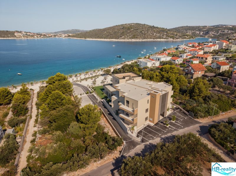 A recreational apartment in Sevid by the sea, surrounded by greenery and a beach.