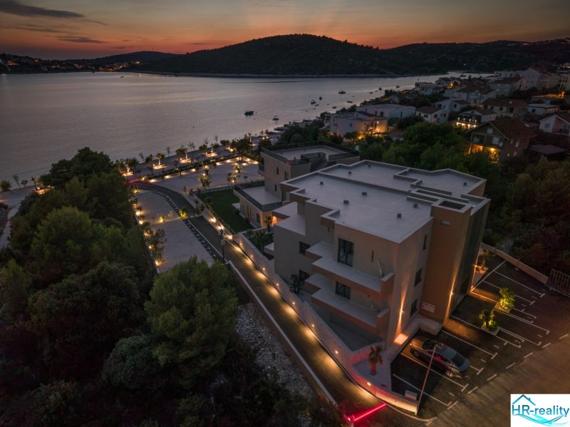 Exterior of a holiday apartment in Sevid, evening view of the lighting and the coastline.