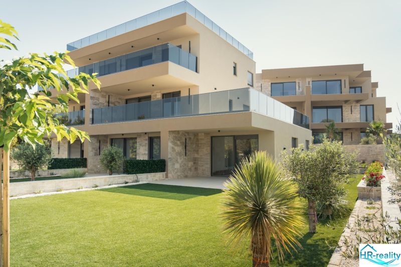 A recreational apartment in Sevid surrounded by greenery, stone facades, and a spacious terrace.