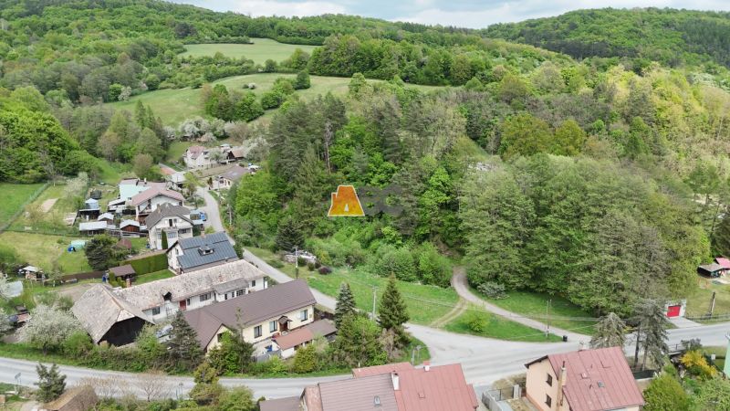 Aerial view of Turová with plots - housing, surrounded by greenery and houses.