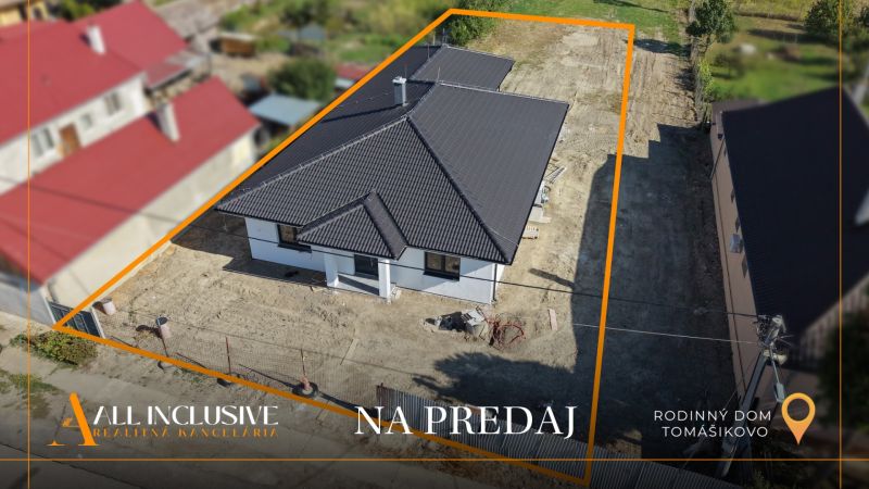 For sale: family house in Tomášikovo with dark roofing and a garden.