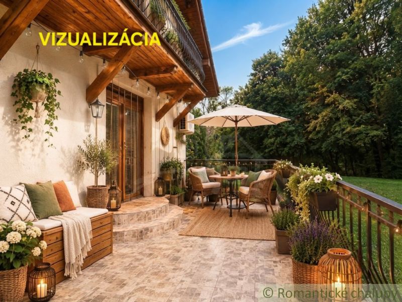 Outdoor terrace of the cottage in Ružiná with comfortable seating and decorative plants.