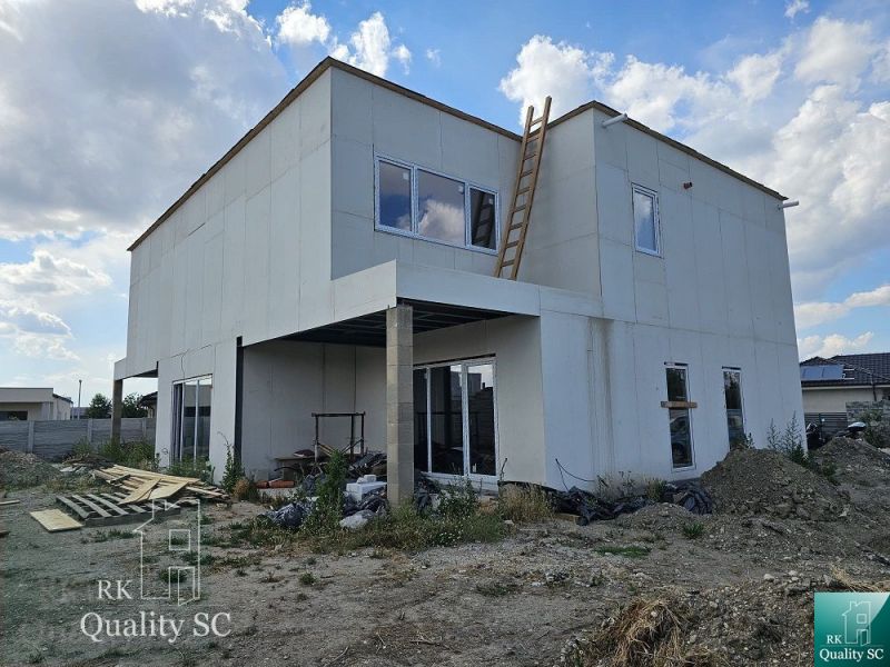 Unfinished family house on Lichnerova Street in Senec, with a white facade and a ladder.