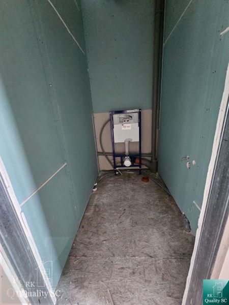 A toilet in a family house prepared for the installation of sanitary equipment.