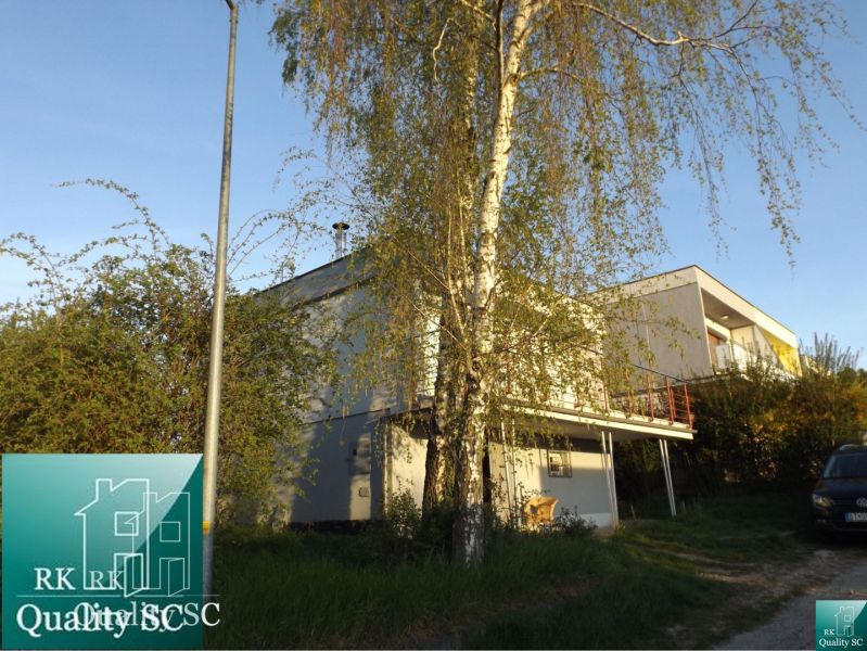 A cottage on SLNEČNÉ JAZERÁ JUH street in Senec surrounded by greenery and trees.
