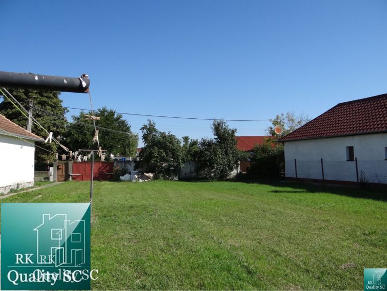 Garden with a lawn on a residential plot on Vrbová Street in Jelka.