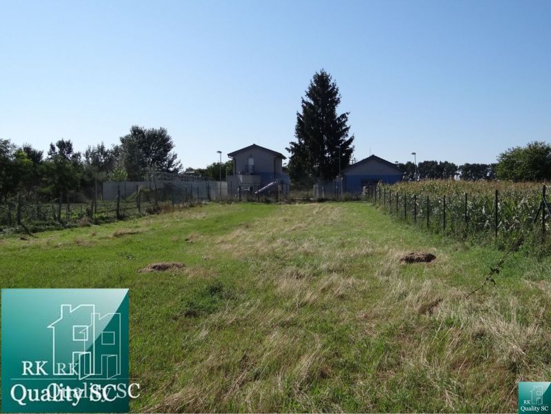 Plots - residential on Vrbová Street in Jelka, with grassy surface and fencing.