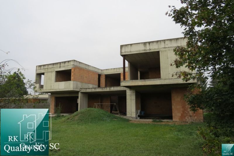 An unfinished family house in Kráľová pri Senci - Záhumenská in Senec, surrounded by greenery.