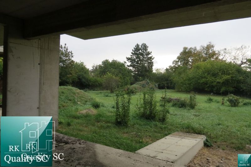 View from the construction of a family house onto a green garden in Kráľová pri Senci on Záhumenská.