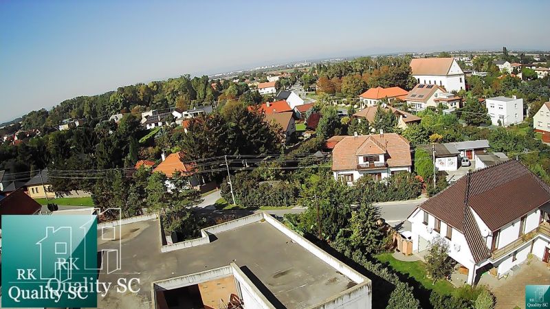 An aerial view of family houses in Kráľová pri Senci - Záhumenská, surrounded by greenery.