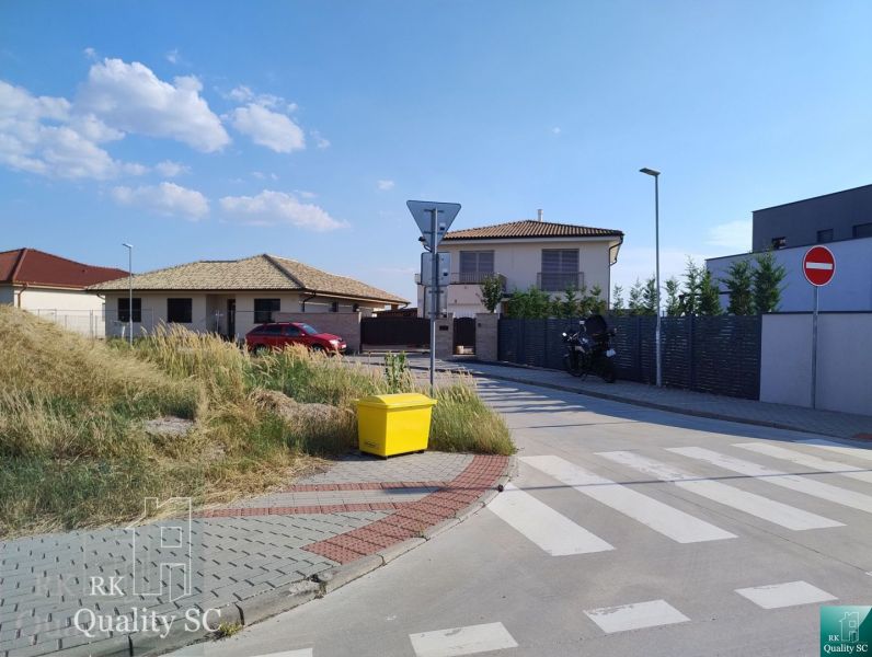 Exterior in Senec for Land - housing, showing a street with family houses.