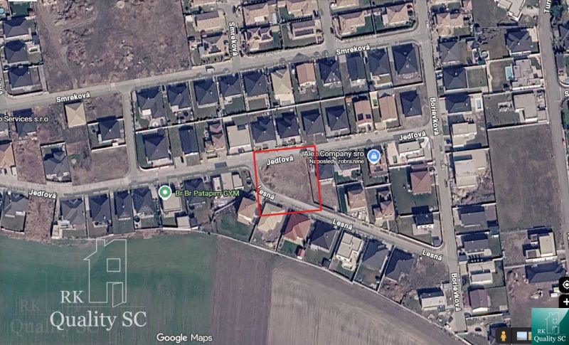 Aerial photograph of residential plots in Senec showing streets and buildings.