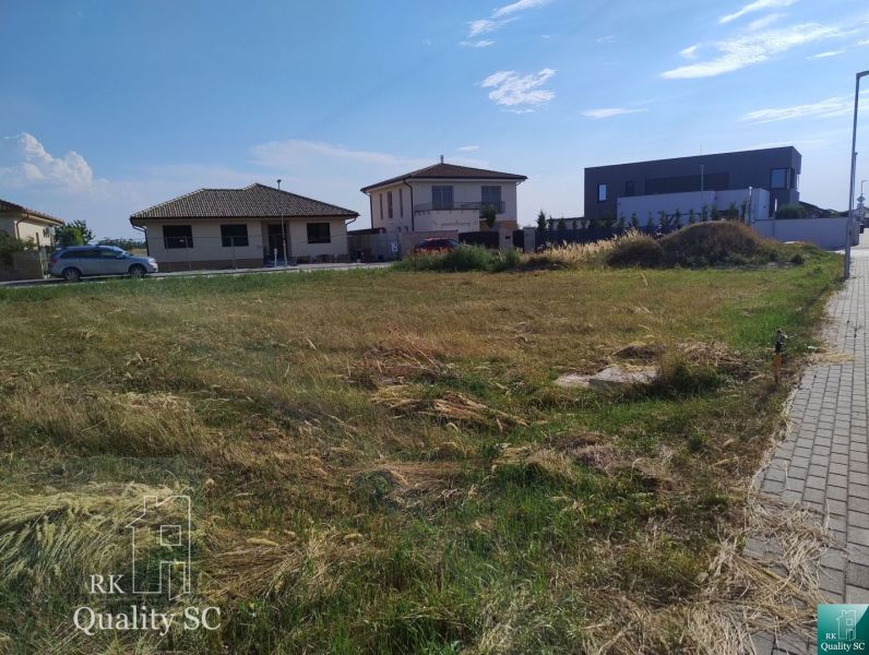 A residential building plot in Senec, surrounded by family houses.