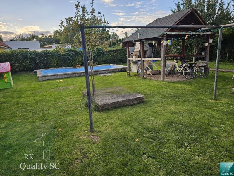 A family house in Tureň with a landscaped garden, gazebo, and swimming pool on Tureň Street.
