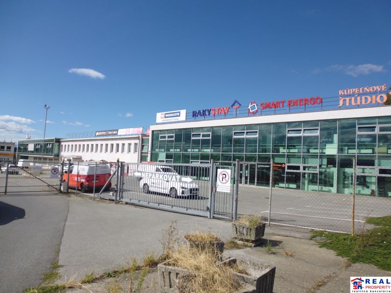 Commercial premises on Strojnícka Street in Prešov with large glass display windows.