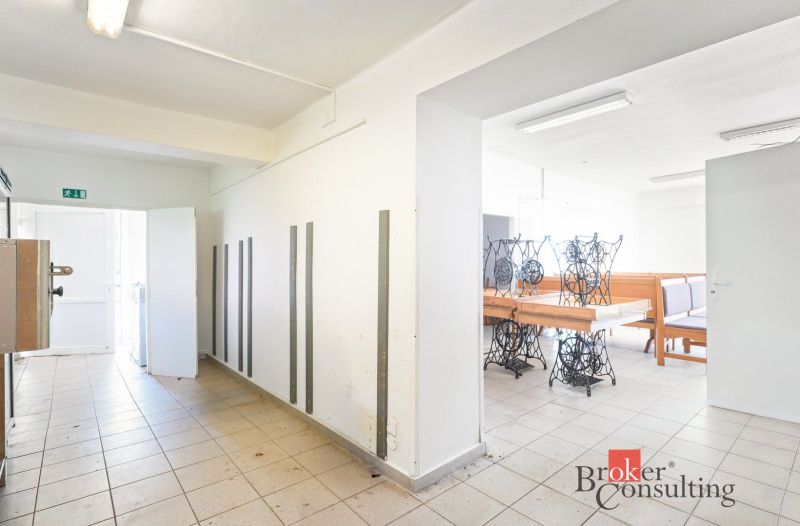 Commercial premises with ceramic tiles, lighting, and custom-made furniture.