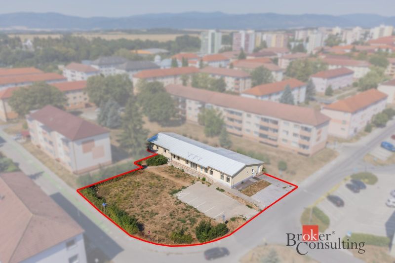 Commercial premises in Žiar nad Hronom on Š. Moysesa Street, surrounded by residential buildings.
