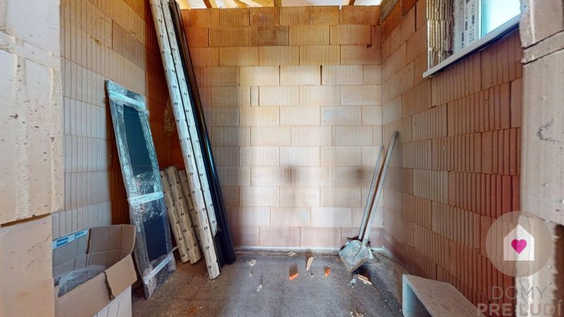 Interior construction with brick walls in a family house, material ready for installation.