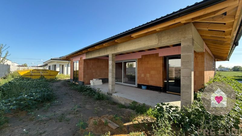 A family house on Hájna Street in Bernolákovo with an unfinished terrace and construction materials.