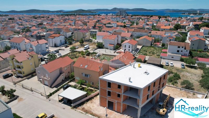 A view of an under-construction holiday apartment in Vodice with a view of the sea and surroundings.