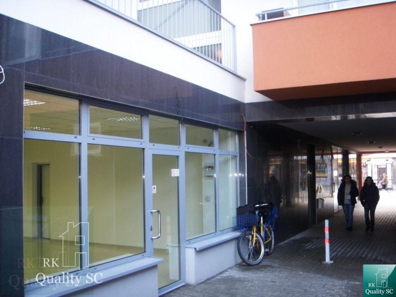 Offices on Lichnerova Street in Senec; glass facade and a bicycle at the entrance.