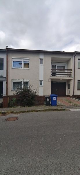 Family house on Astrova Street in Banská Bystrica with a balcony and driveway.