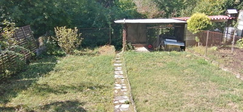 The garden at the family house on Astrová Street in Banská Bystrica with a gazebo.