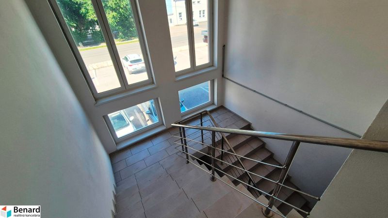 A staircase with large windows in a 2-room apartment, view of Levočská Street, Stará Ľubovňa.