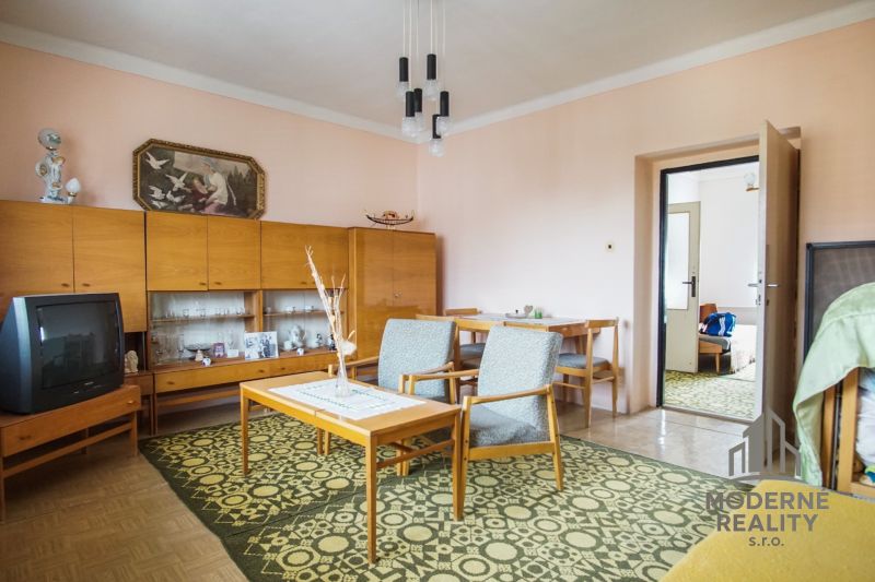 Living room in a family house with retro furniture and decor.