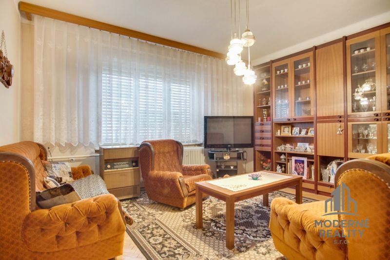 Living room in a family house with retro furniture and comfortable armchairs.